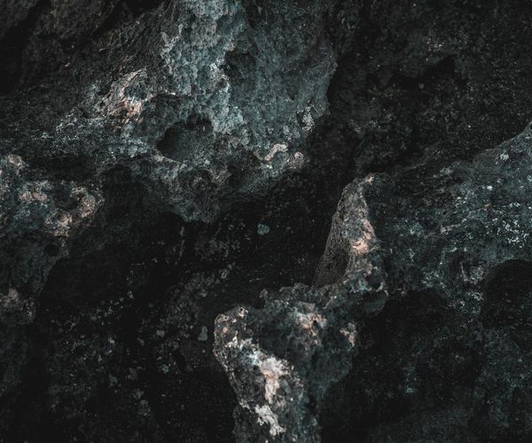 Man stretching his arms upwards with a bright lava background effect